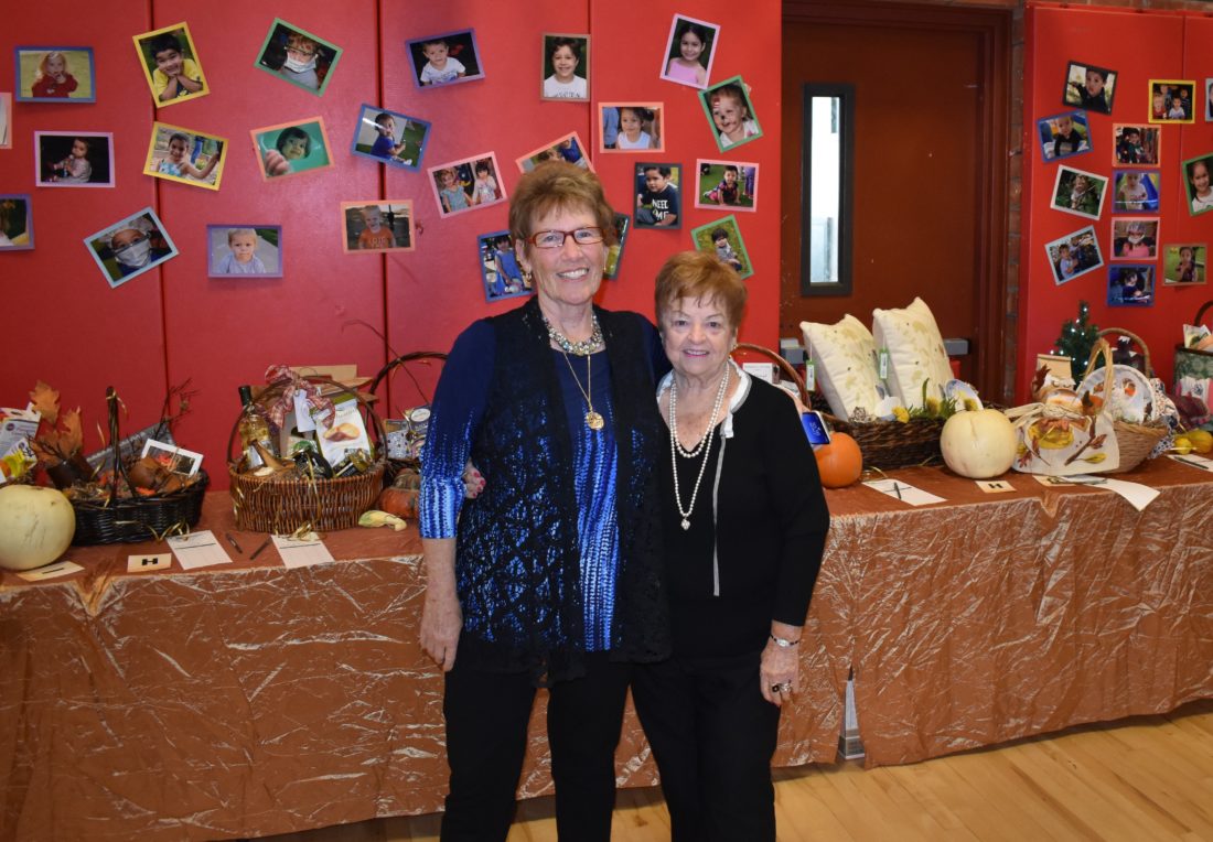 Volunteers Claudia Lash, left, and Pat Lupo started the annual St. Vincent’s fashion show as a benefit for the nonprofit, which helps local families