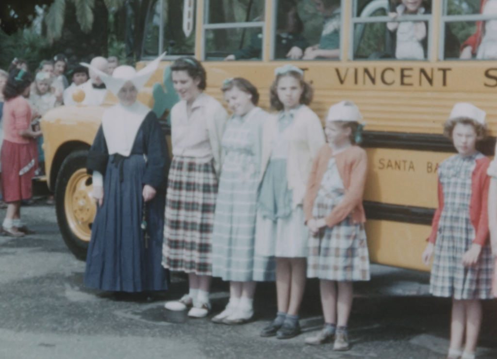 Dedication of new school bus and girls in [illegible] concrete tennis court. Ca 1954